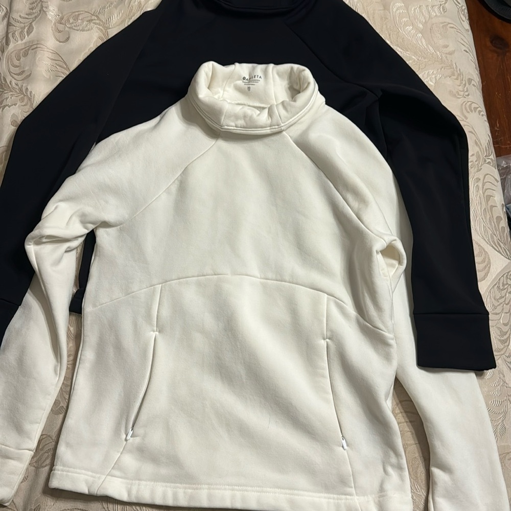 2 Athletica pull overs cream and black size xs